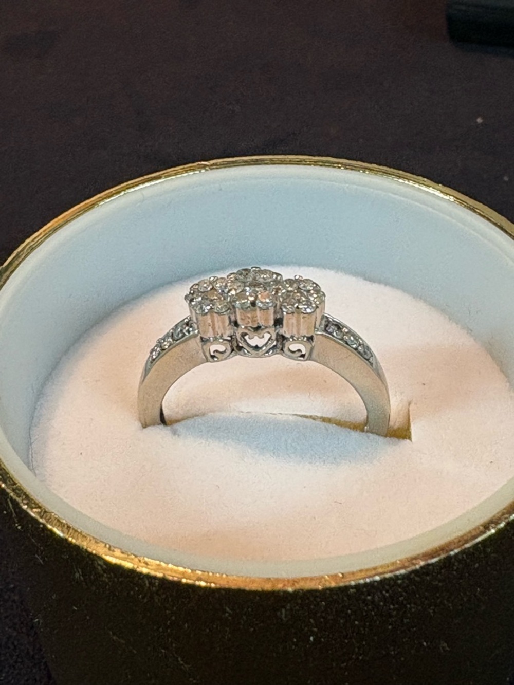 10K white gold and diamond “floral” setting.